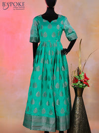 Raw silk floor length kurti teal green with silver zari buttas and back design