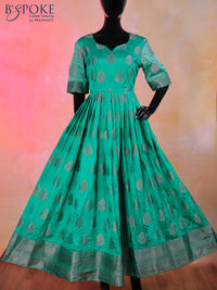 Raw silk floor length kurti teal green with silver zari buttas and back design