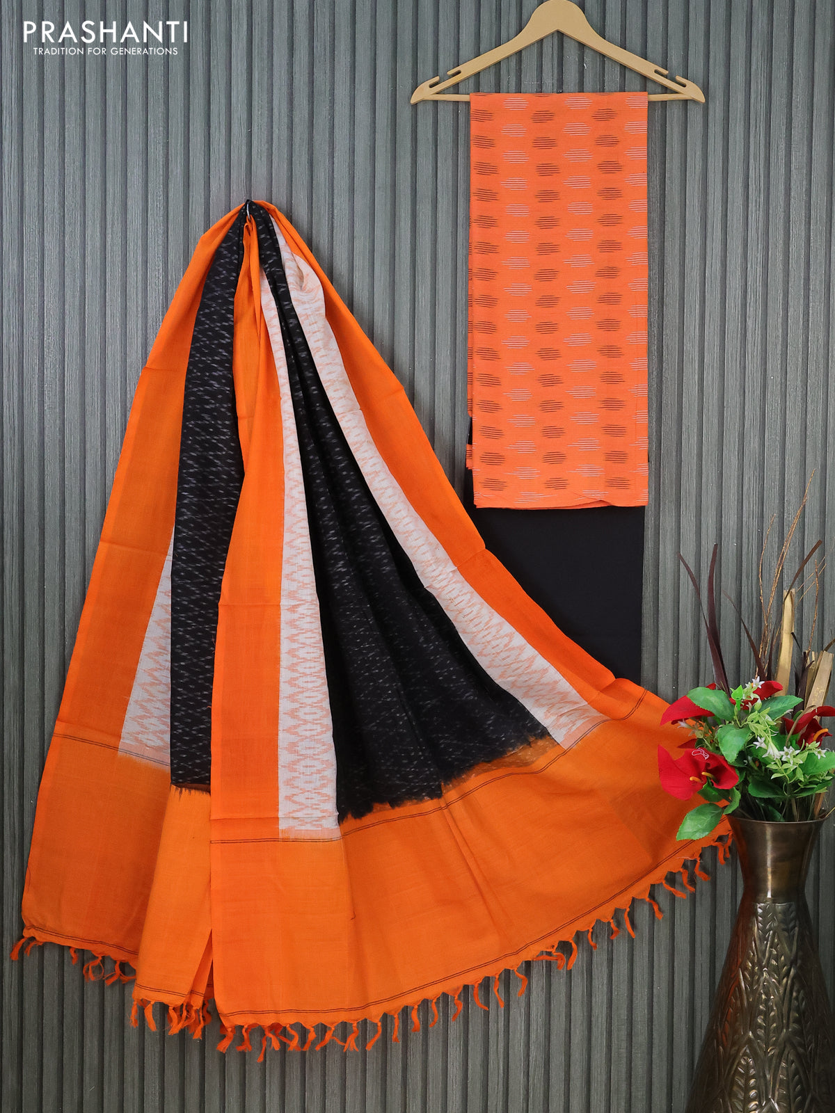 Ikat cotton dress material orange and black with allover ikat butta weaves and bottom & dupatta