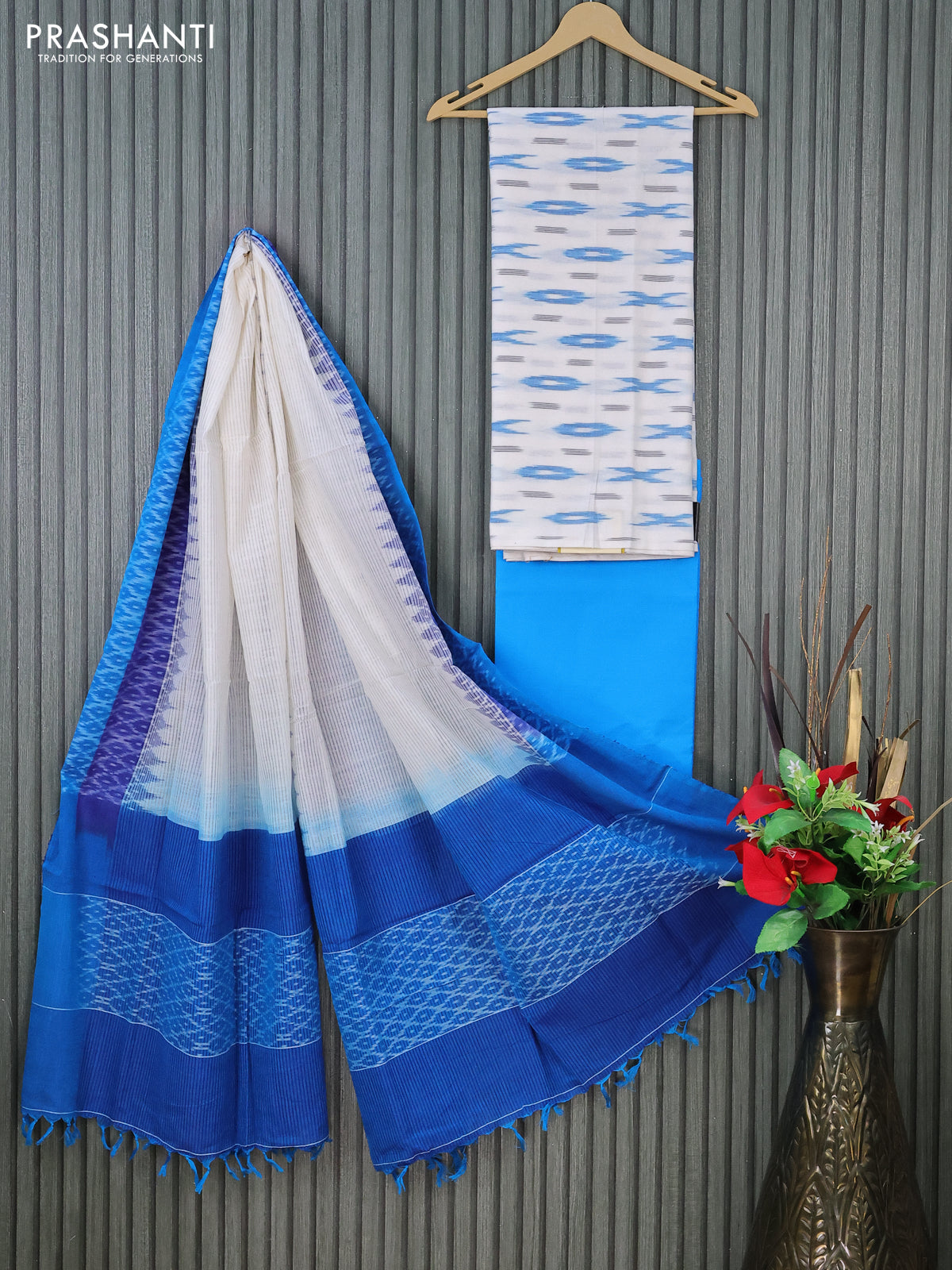 Ikat cotton dress material off white and cs blue with allover ikat butta weaves and bottom & dupatta