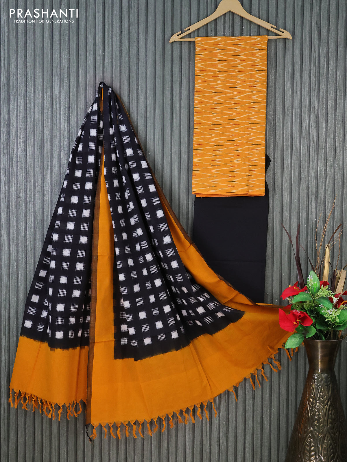 Ikat cotton dress material mustard yellow and black with allover ikat weaves and bottom & dupatta