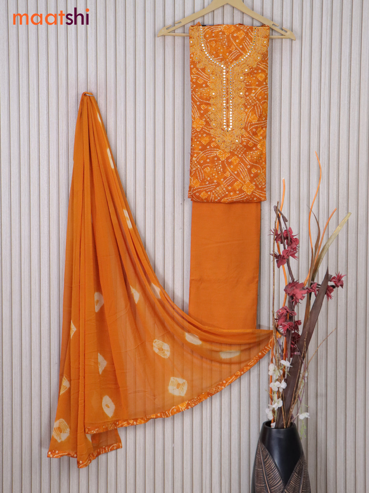 Cotton dress material orange with allover bandhani prints & embroidery mirror work neck pattern and bottom & printed dupatta