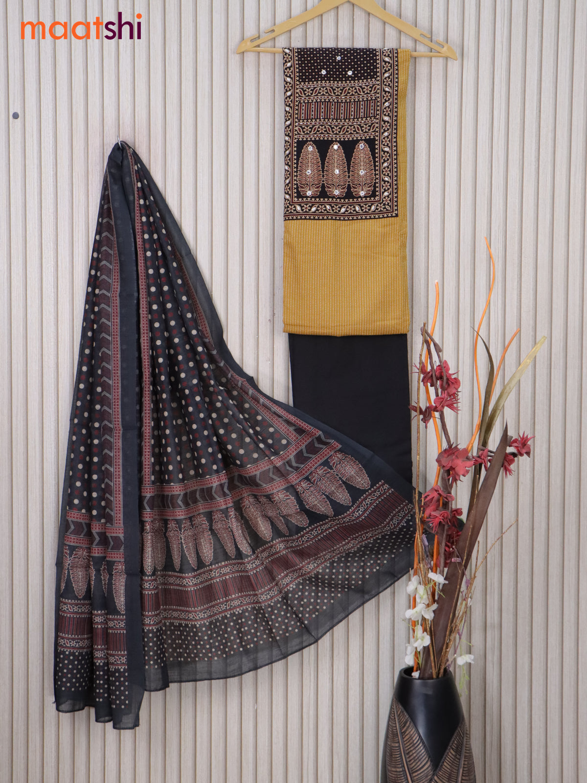 Cotton dress material mustard shade and black with allover thread weaves & printed neck pattern and bottom & printed dupatta