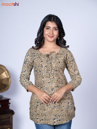 Kalamkari cotton short kurti mehendi green shade and beige with allover prints & lace work neck pattern without pant