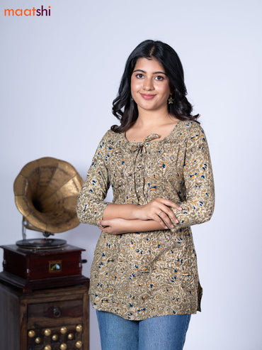 Kalamkari cotton short kurti mehendi green shade and beige with allover prints & lace work neck pattern without pant