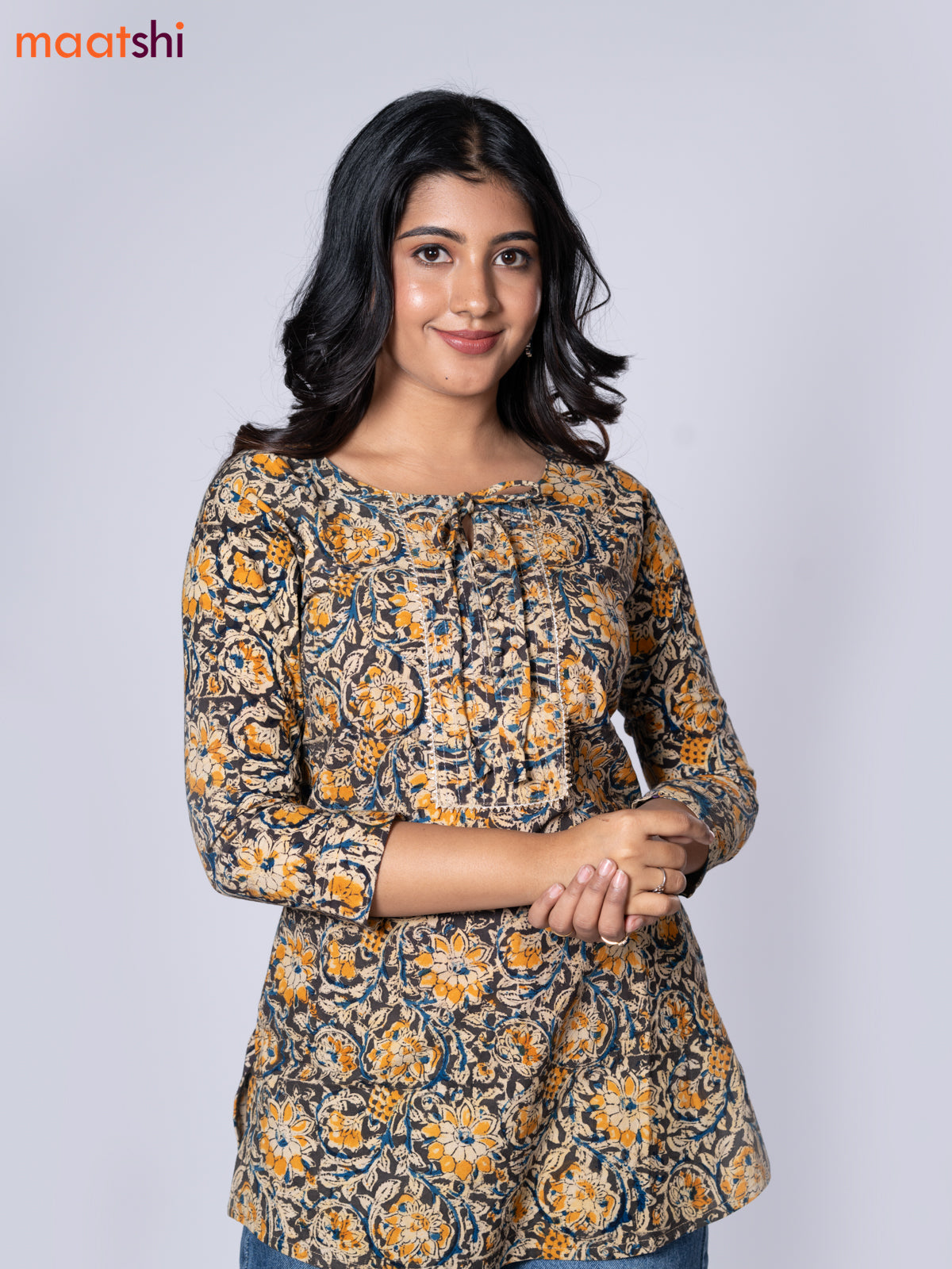 Kalamkari cotton short kurti multi colour and yellow shade with allover prints & lace work neck pattern without pant