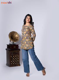 Kalamkari cotton short kurti multi colour and yellow shade with allover prints & lace work neck pattern without pant