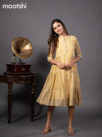 Chiffon readymade dress yellow with allover floral prints & simple collar neck design without pant