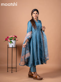 Tissue anarkali salwar suit peacock blue with allover prints & simple neck pattern and straight cut pant & floral prints tissue dupatta