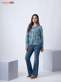 Women's shirt pastel blue and grey with allover floral prints and collar neck pattern