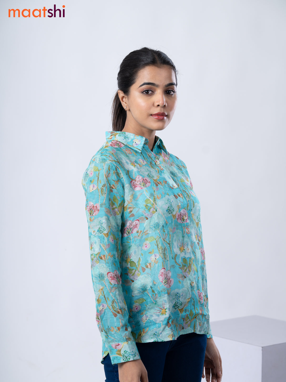 Women's shirt teal blue with allover floral prints and collar neck pattern