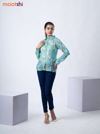 Women's shirt teal blue with allover floral prints and collar neck pattern