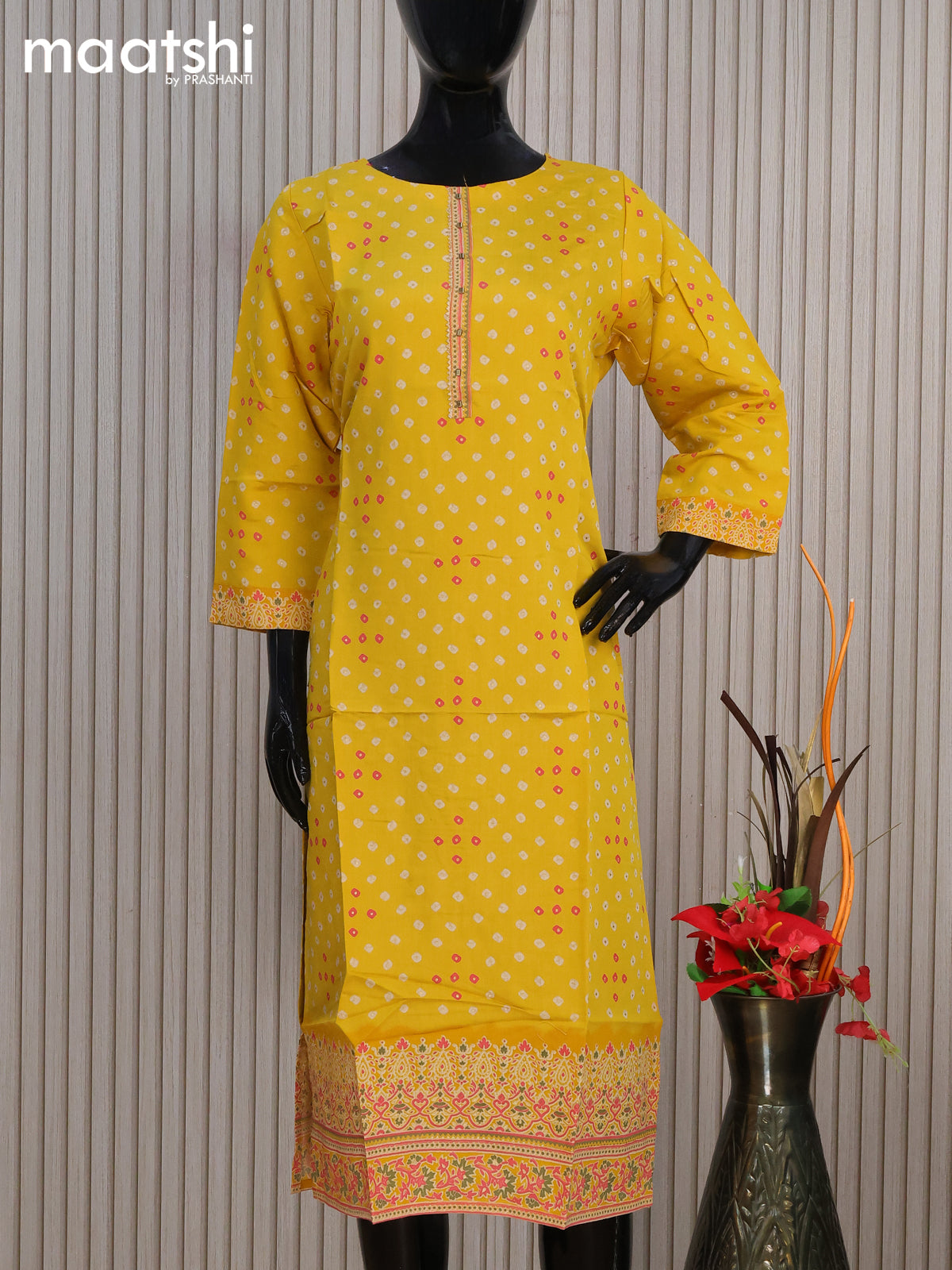 Modal readymade kurti yellow with allover bandhani prints & simple work neck pattern without pant