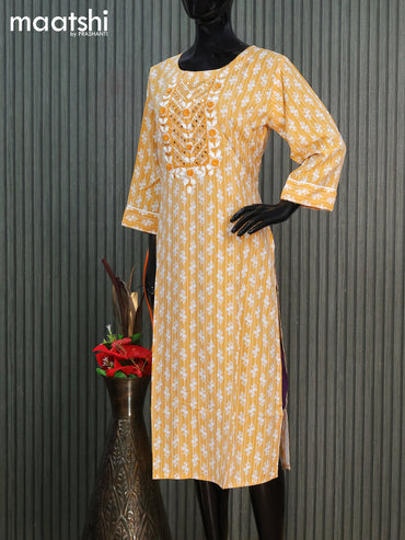 Cotton readymade kurti mustard yellow with allover butta prints & embroidery mirror work neck pattern without pant