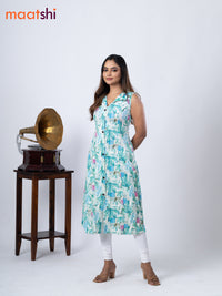 Rayon A-line kurti cream and teal green shade with allover prints & thread weaves collar neck without pant & sleeve attached