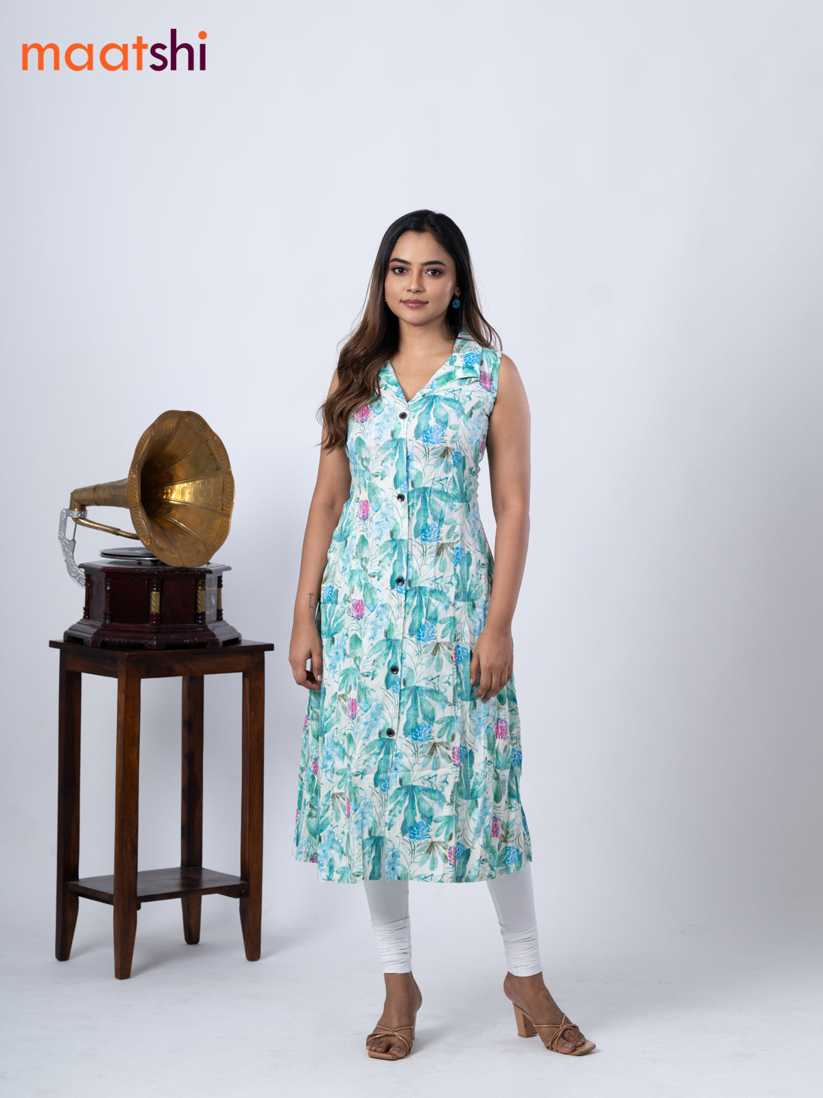 Rayon A-line kurti cream and teal green shade with allover prints & thread weaves collar neck without pant & sleeve attached