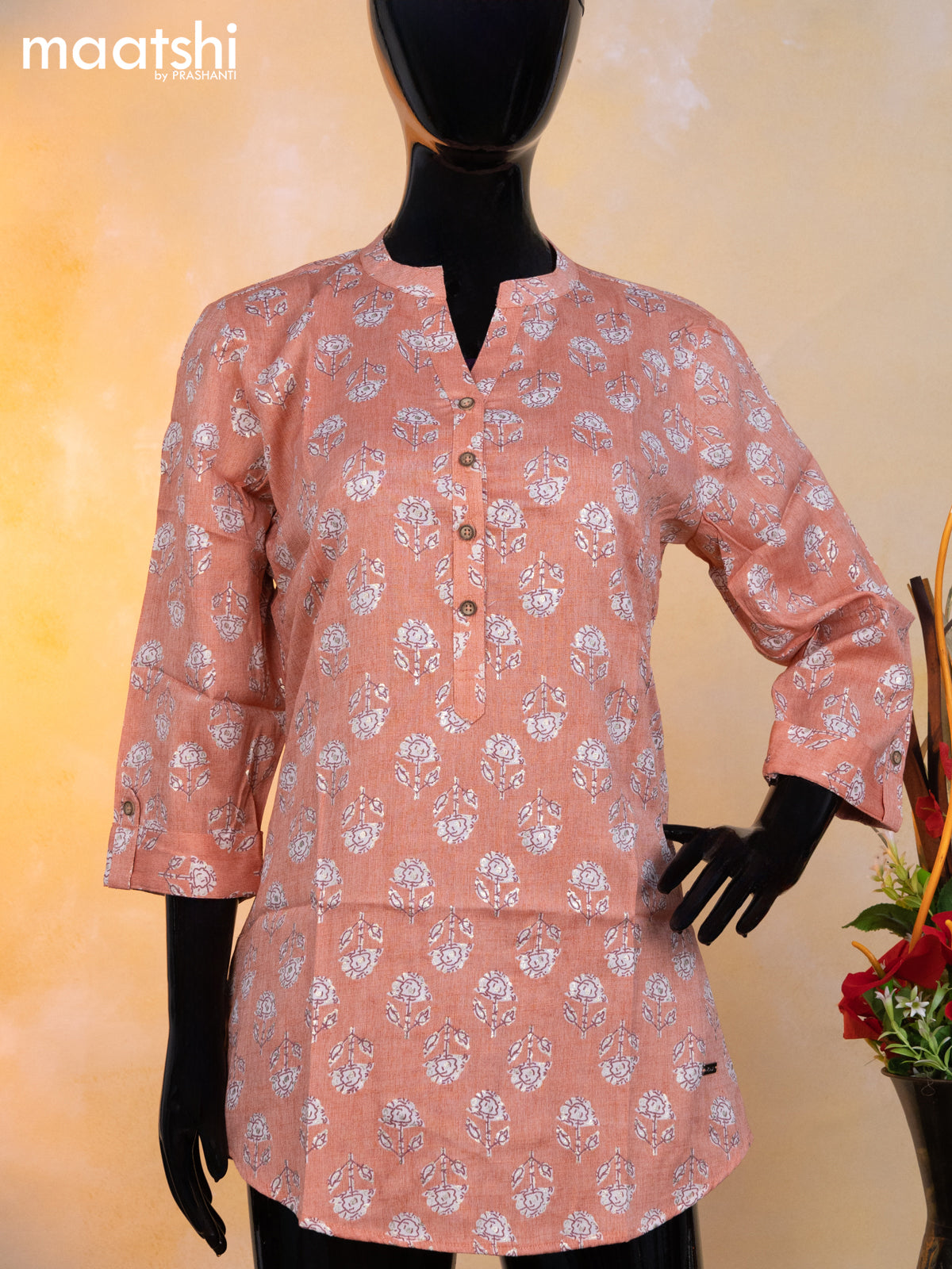 Rayon readymade short kurti peach and off white with allover floral butta prints & simple neck pattern without pant