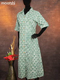 Cotton readymade A-line kurti pastel green with allover batik prints & simple neck pattern without pant