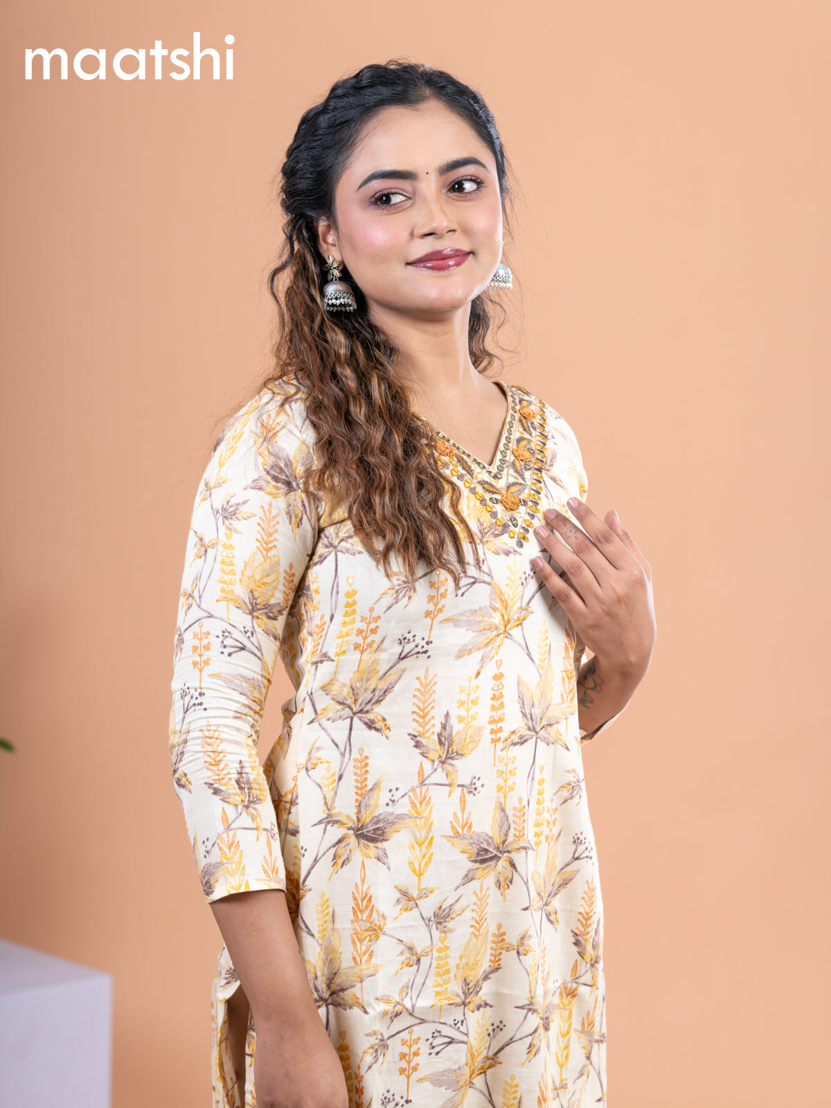 Cotton readymade kurti pale yellow with allover prints & embroidery mirror work v neck pattern without pant