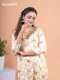 Cotton readymade kurti pale yellow with allover prints & embroidery mirror work v neck pattern without pant