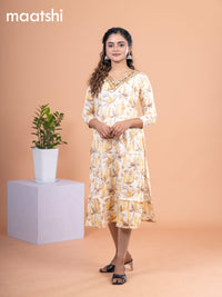 Cotton readymade kurti pale yellow with allover prints & embroidery mirror work v neck pattern without pant