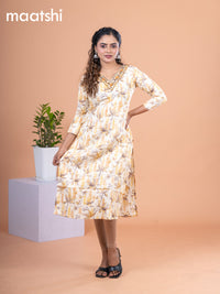 Cotton readymade kurti pale yellow with allover prints & embroidery mirror work v neck pattern without pant