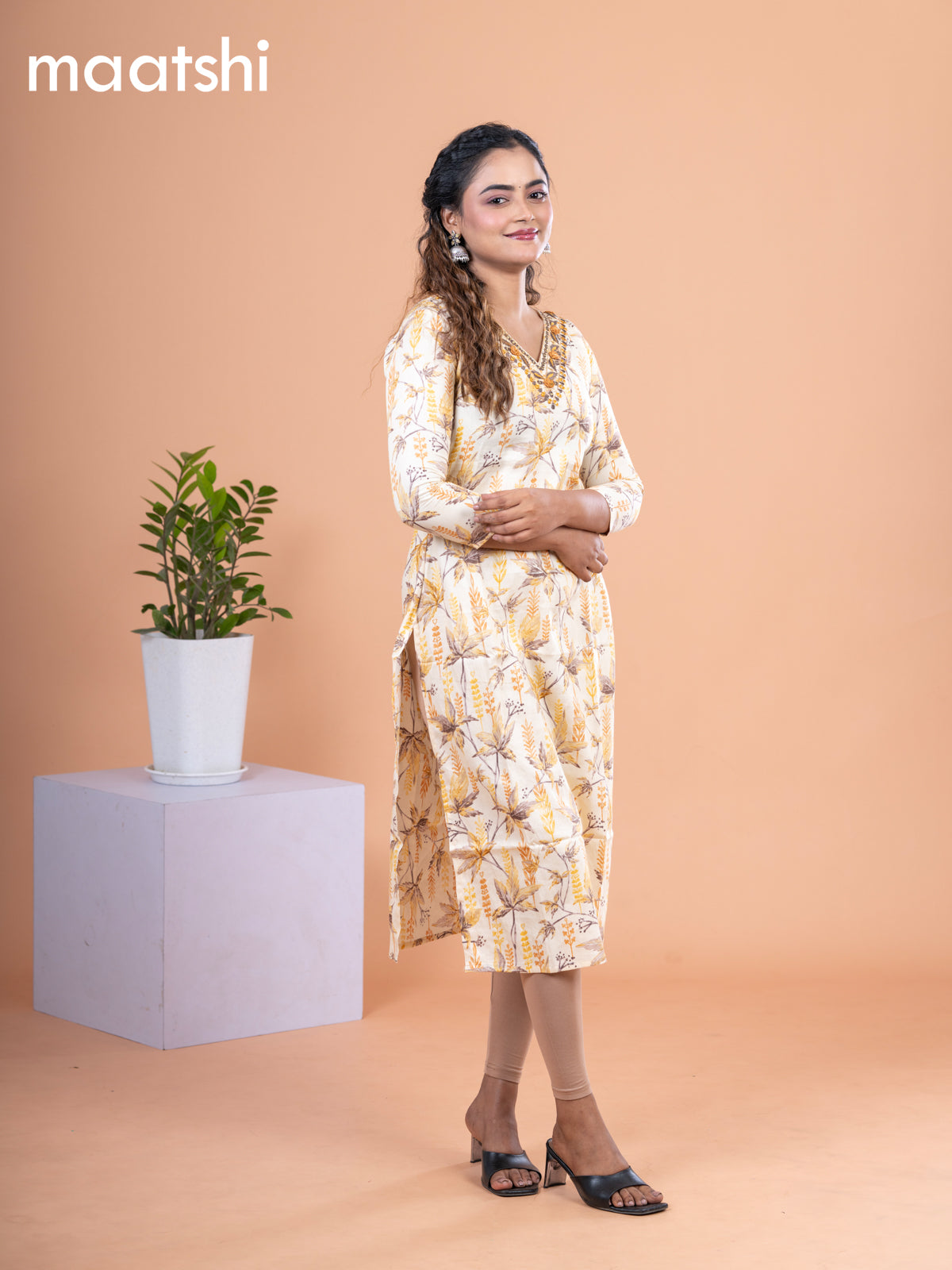 Cotton readymade kurti pale yellow with allover prints & embroidery mirror work v neck pattern without pant