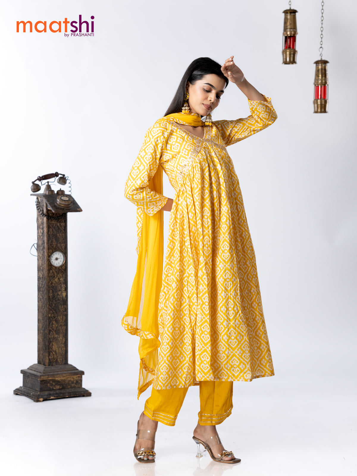 Muslin readymade alia cut salwar suit yellow and off white with allover ikat prints & embroidery mirror work neck pattern and straight cut pant & chiffon dupatta