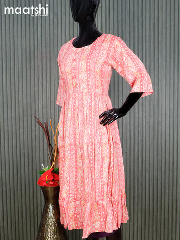 Rayon readymade umbrella kurti pink and cream with allover prints & simple neck pattern without pant