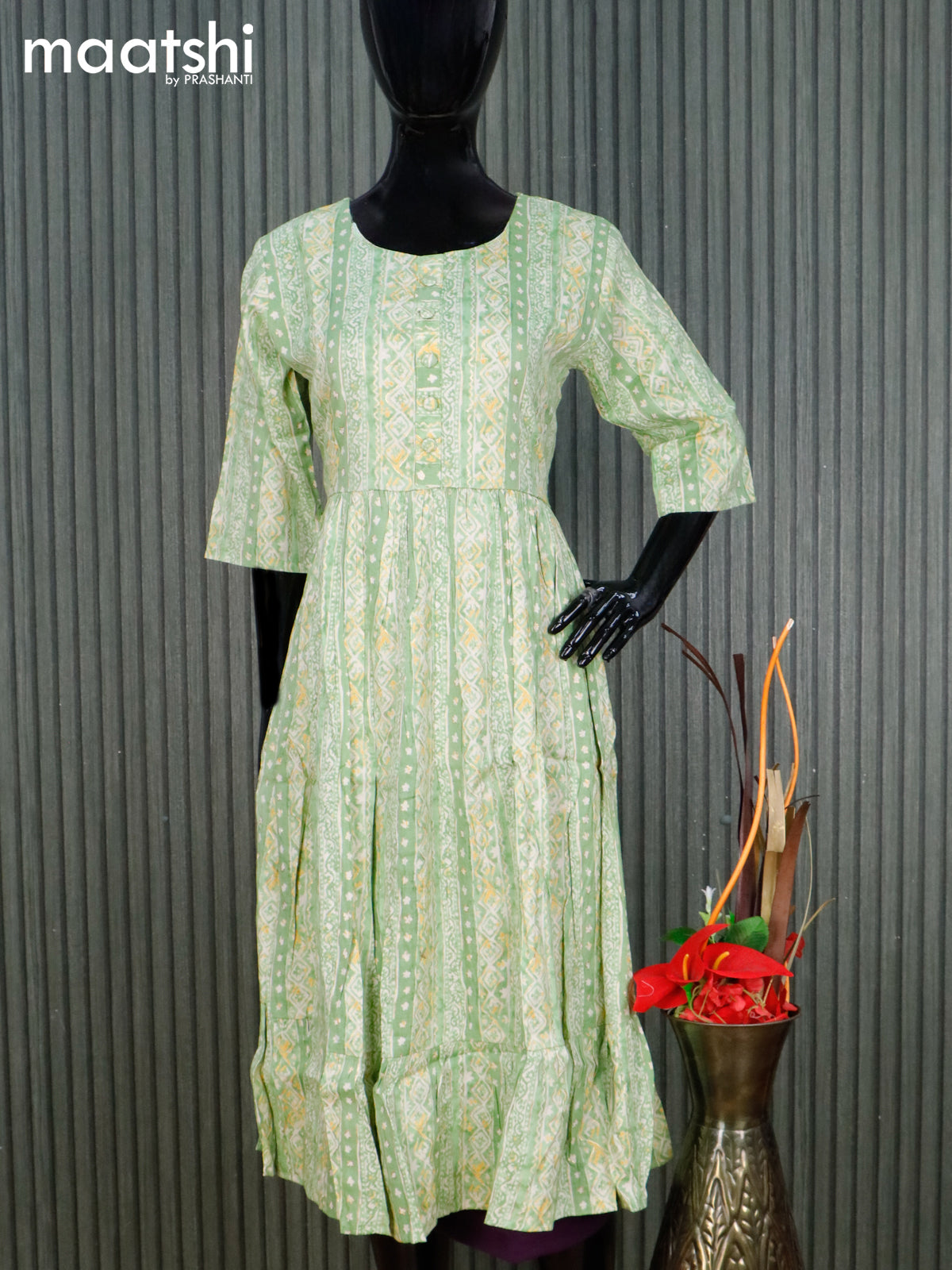 Rayon readymade umbrella kurti light green and cream with allover prints & simple neck pattern without pant