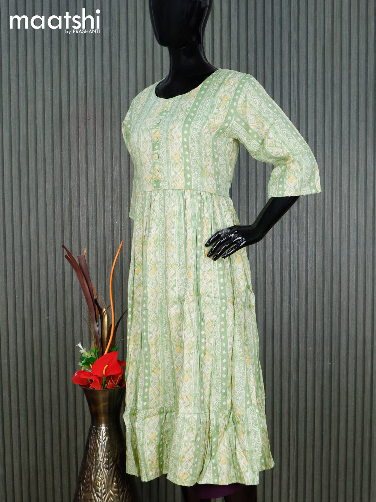 Rayon readymade umbrella kurti light green and cream with allover prints & simple neck pattern without pant