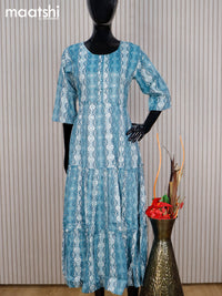 Rayon readymade umbrella kurti pastel blue and off white with allover prints & simple neck pattern without pant