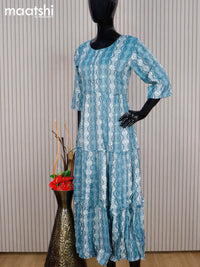 Rayon readymade umbrella kurti pastel blue and off white with allover prints & simple neck pattern without pant