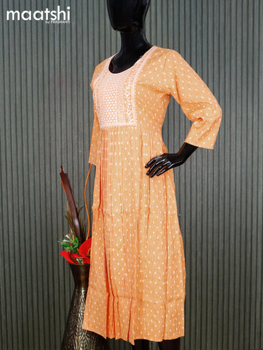 Cotton readymade umbrella kurti pale orange and off white with allover butta prints & embroidery sequin work neck pattern without pant