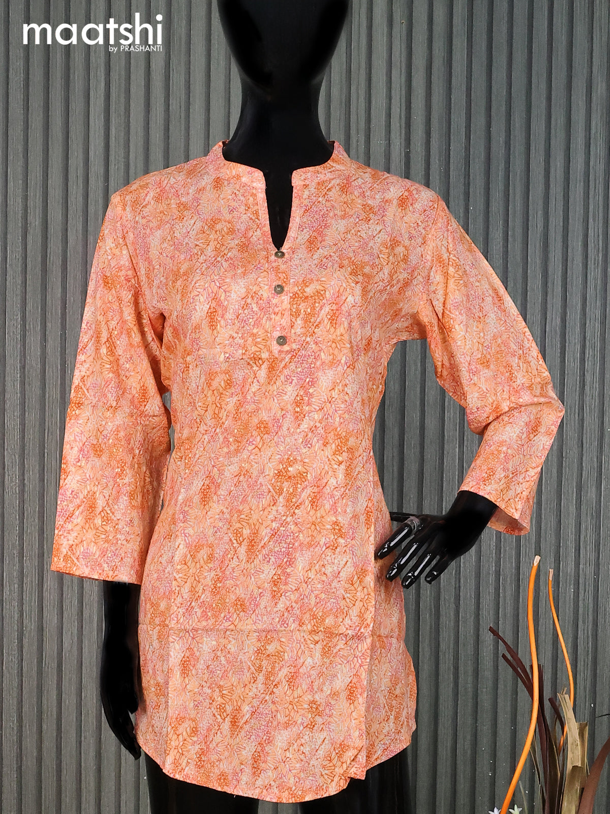 Cotton readymade short kurti pale orange with allover prints & simple neck pattern without pant