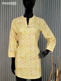 Cotton readymade short kurti pale yellow and off white with allover prints & simple neck pattern without pant