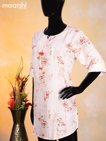 Cotton readymade short kurti mild peach with allover floral prints & simple neck pattern without pant