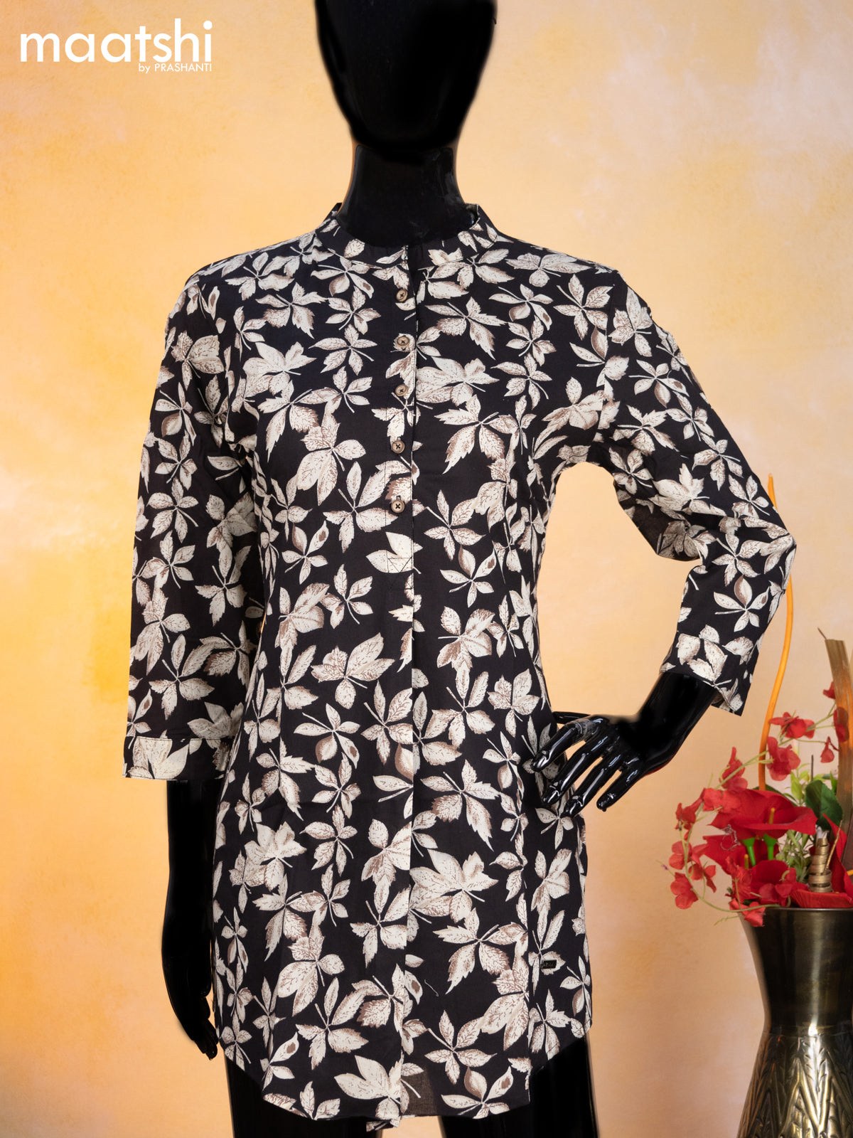 Cotton readymade short kurti black and beige with allover leaf prints & simple neck pattern without pant