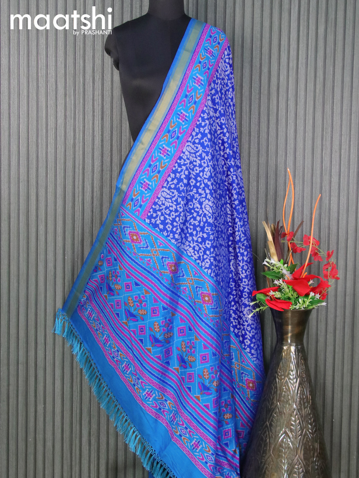 Semi tussar dupatta blue and cs blue with allover batik prints and zari woven border