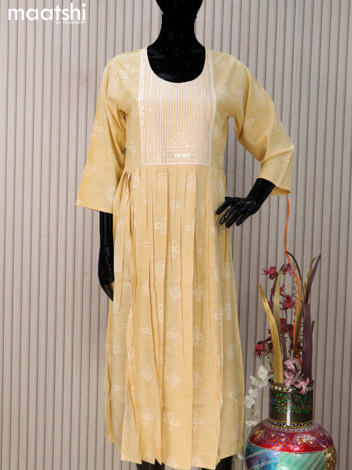 Rayon readymade umbrella kurti pale yellow with prints & sequin work neck pattern without pant