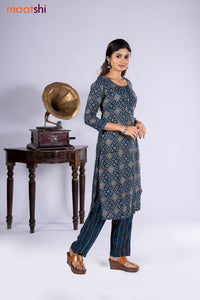 Rayon kurti navy blue with allover ikat prints & simple neck pattern and straight cut pant