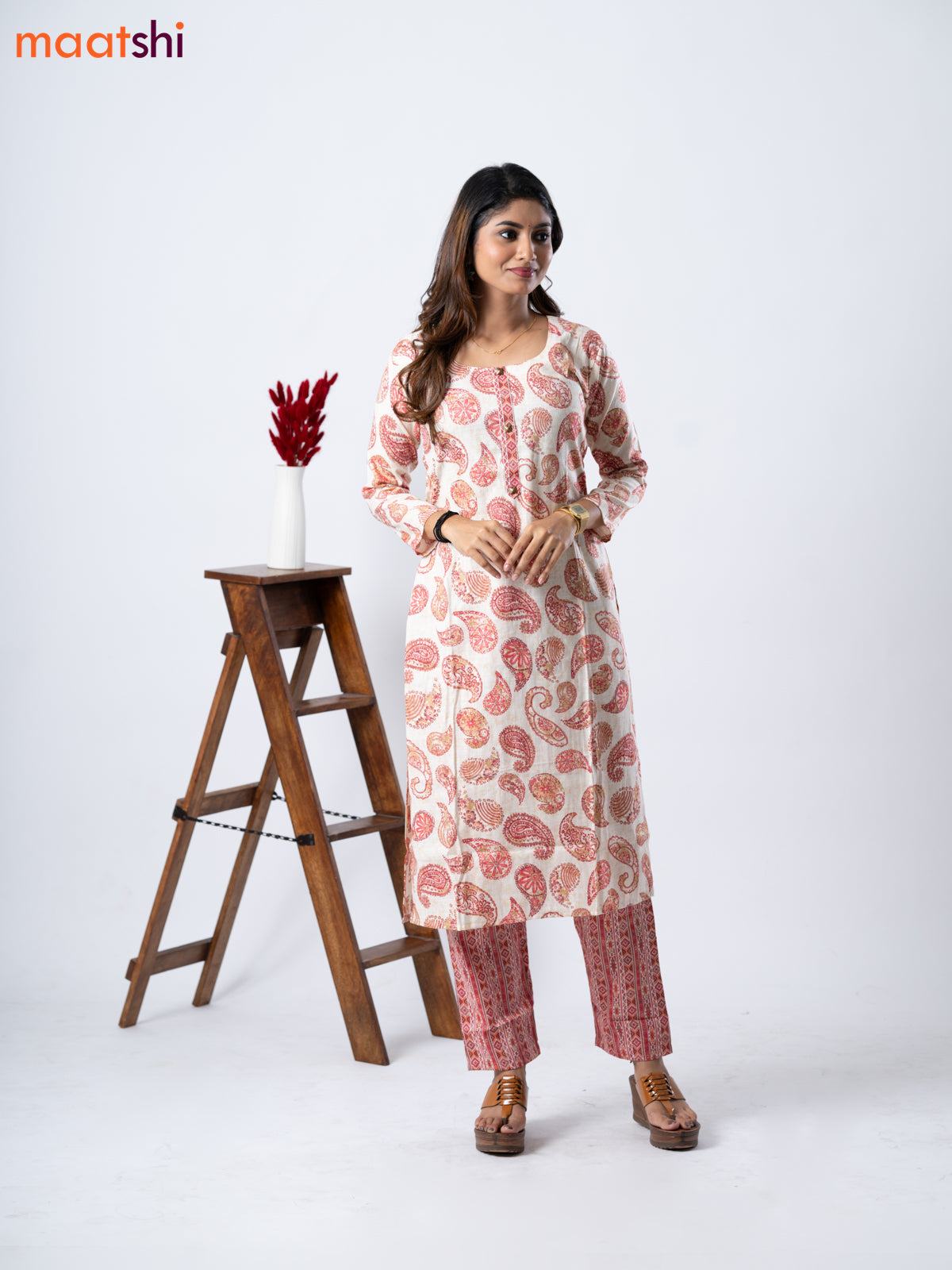 Rayon kurti set cream and red shade with allover paisley prints & simple neck pattern and straight cut pant