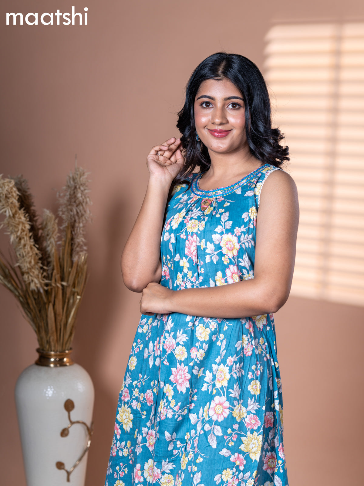 Cotton dress blue shade with allover floral prints & embroidery neck pattern and without pant & sleeve attached