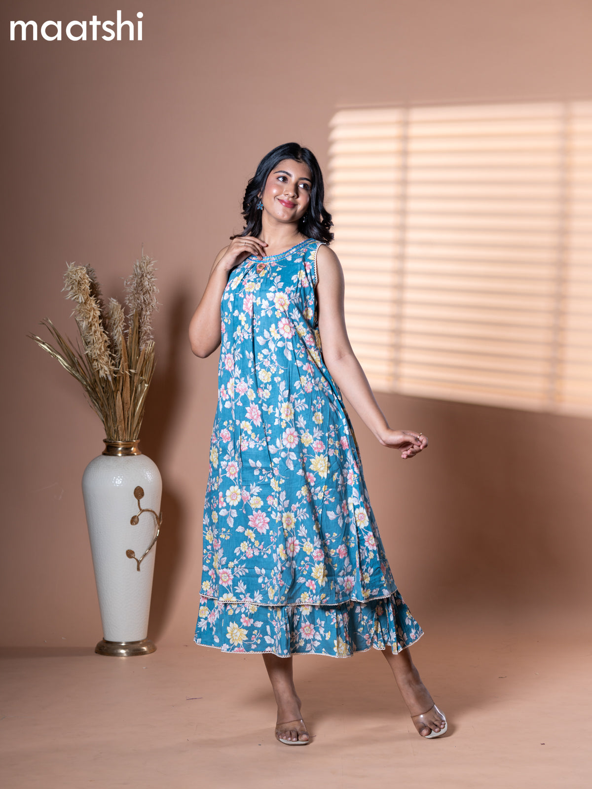 Cotton dress blue shade with allover floral prints & embroidery neck pattern and without pant & sleeve attached