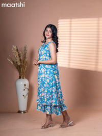 Cotton dress blue shade with allover floral prints & embroidery neck pattern and without pant & sleeve attached