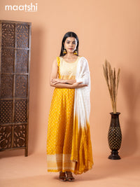 Chanderi anarkali salwar suit mustard yellow and off white with allover butta prints & sequin work neck pattern and straight cut pant & chiffon dupatta - sleeves attached