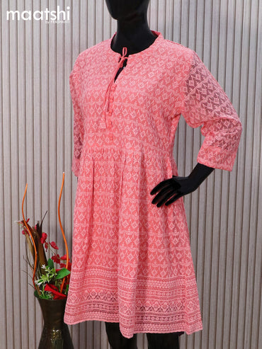 Semi georgette readymade tunic top peach shade with allover chikankari work & simple neck pattern without pant