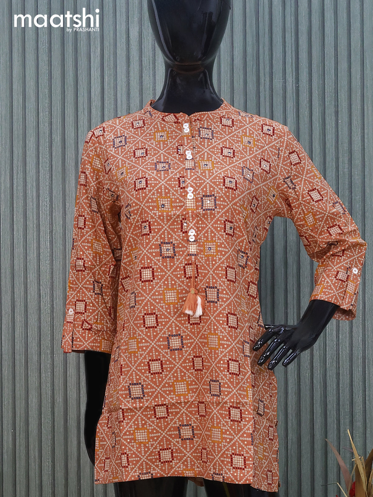 Cotton readymade short kurti peach shade with allover bandhani prints & mirror work without pant