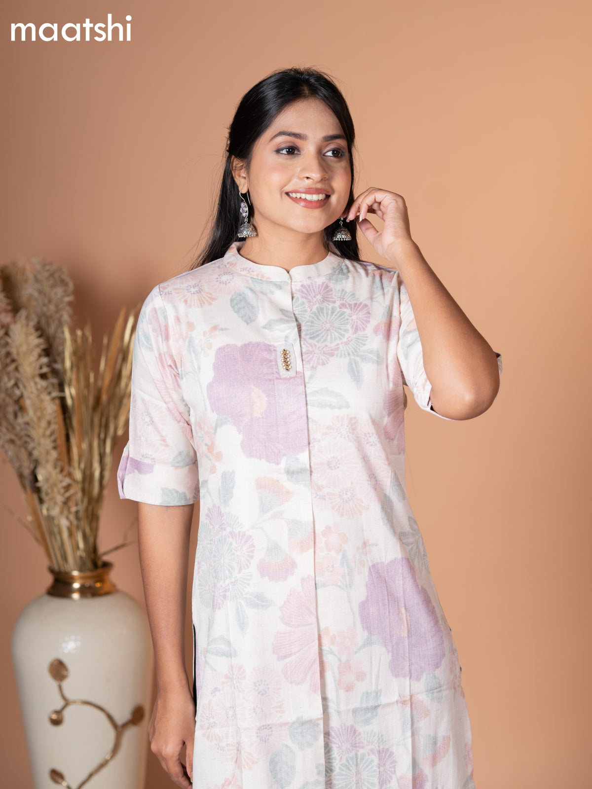 Rayon kurti off white with allover leaf prints & simple neck pattern without pant