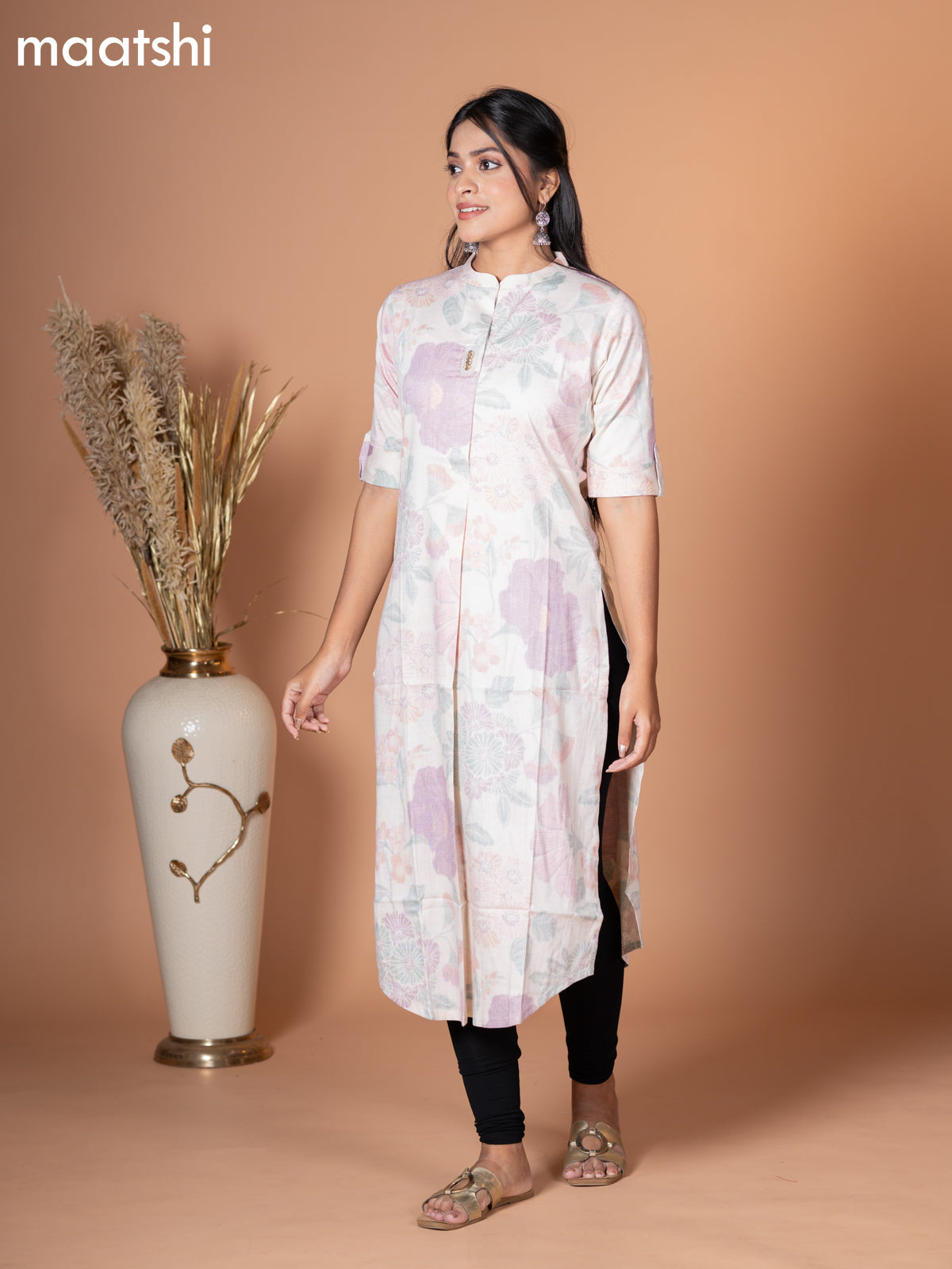 Rayon kurti off white with allover leaf prints & simple neck pattern without pant